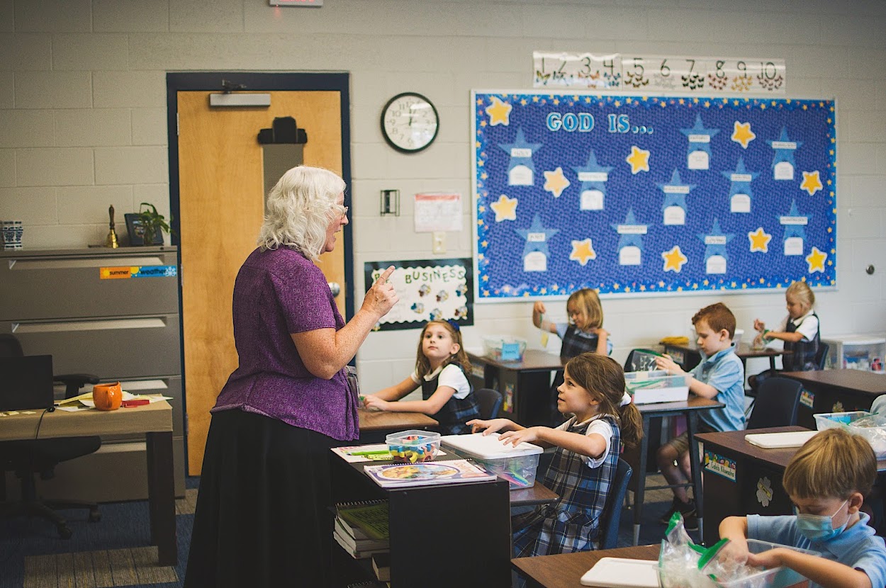 The first grade class enjoys learning.