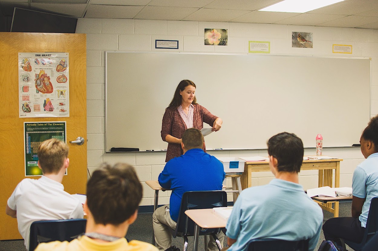 High school students enjoy science class.