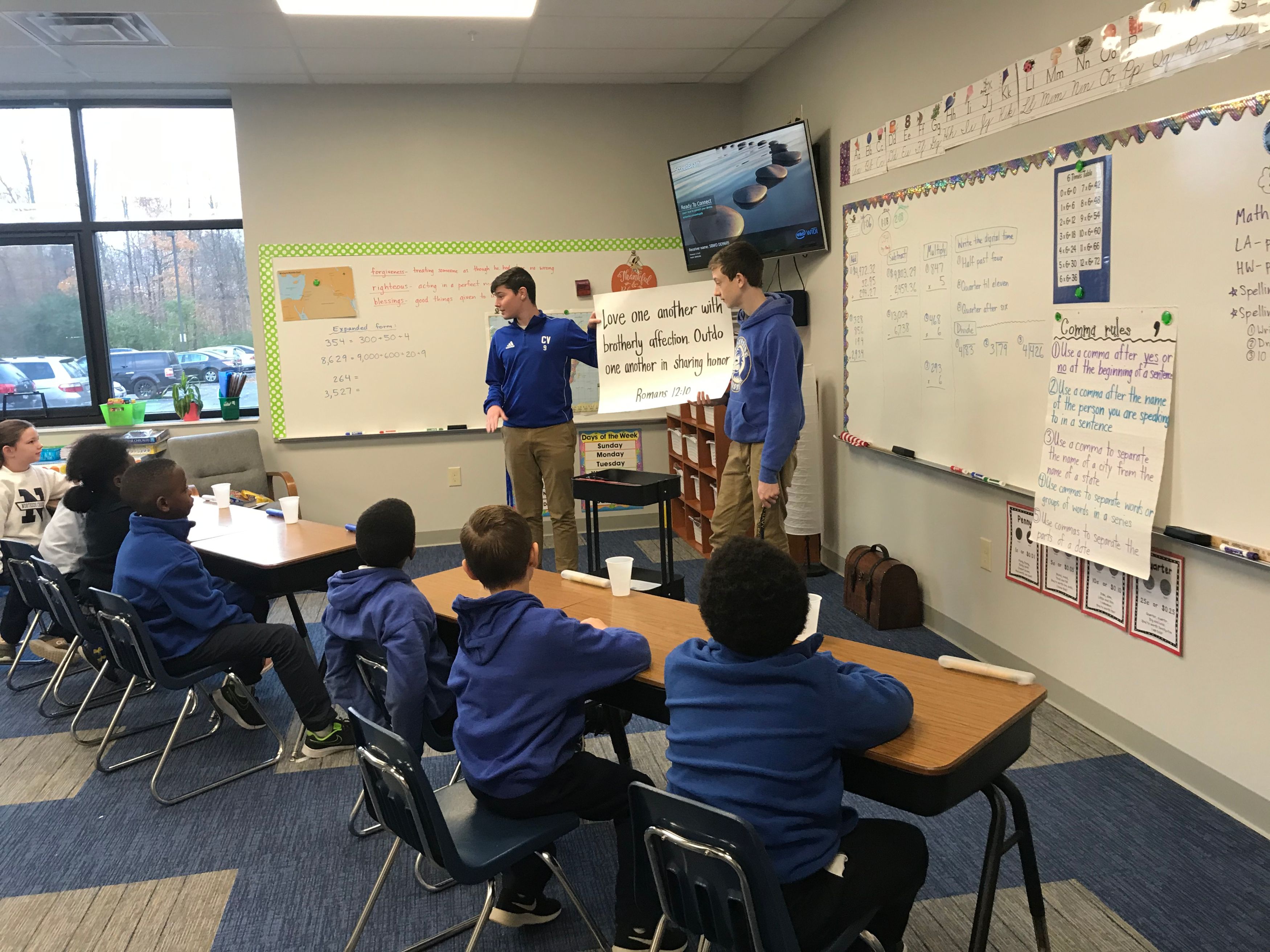 High school mentors teach a Bible lesson to elementary students.